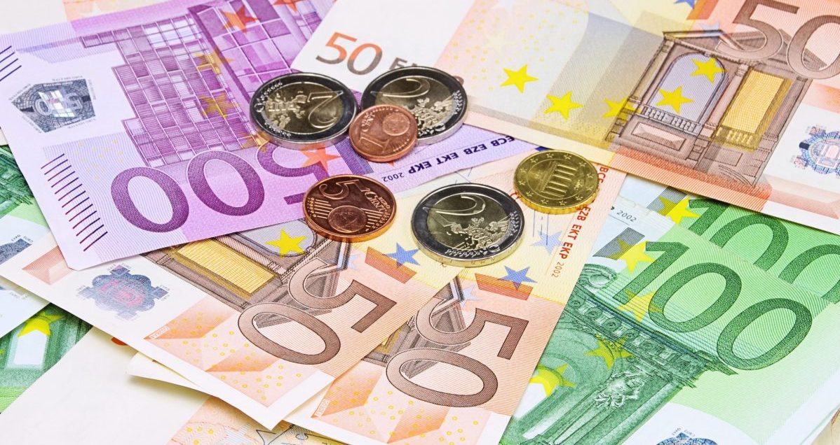Euro banknotes and coins displayed together.