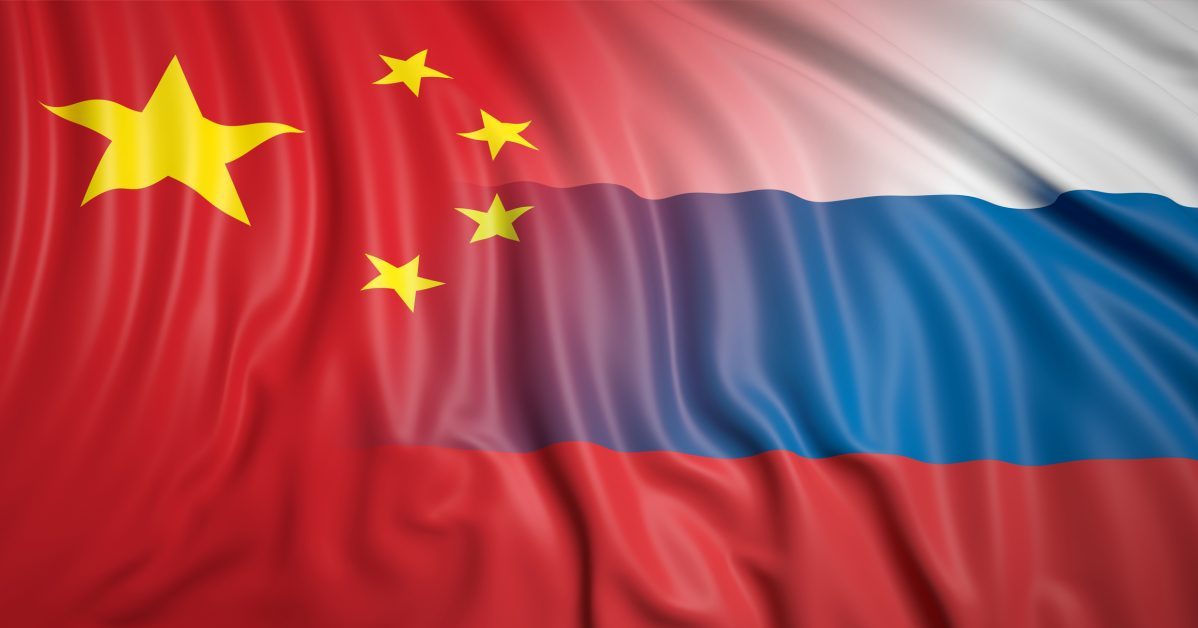 Close-up of Russian and Chinese flags