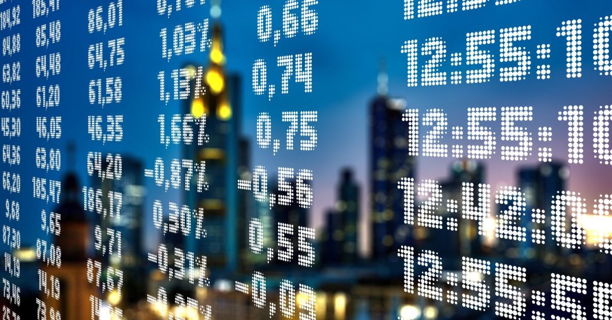 Financial data and numbers overlaid on a city skyline.