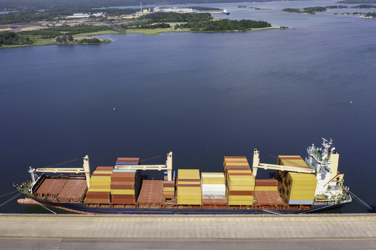 Container ship at the quay of a Baltic Sea harbor.