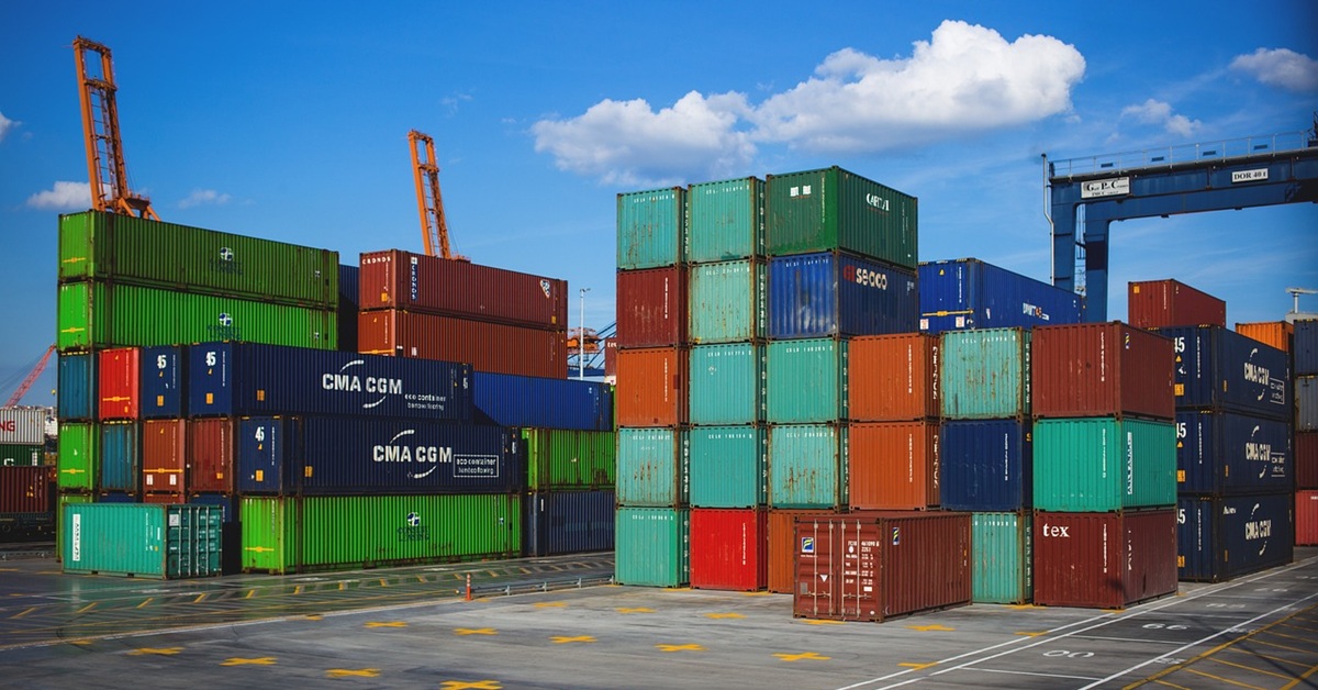 Stacked shipping containers in a port.