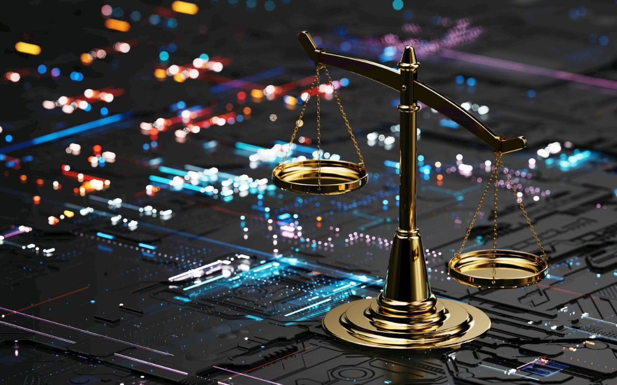 Scales of justice against a digital technology background.